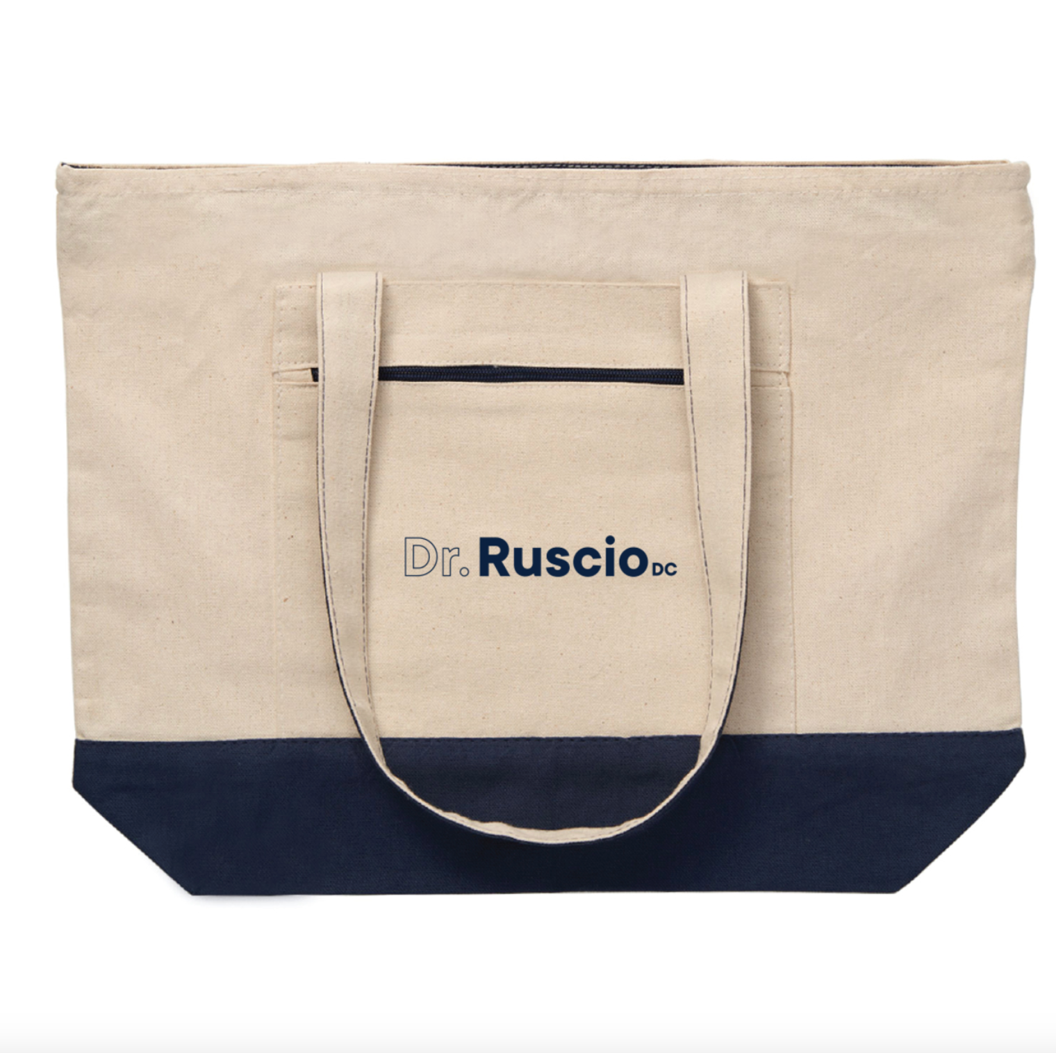 Canvas tote bag with navy bottom section and 'Dr. Ruscio DC' logo on a natural background